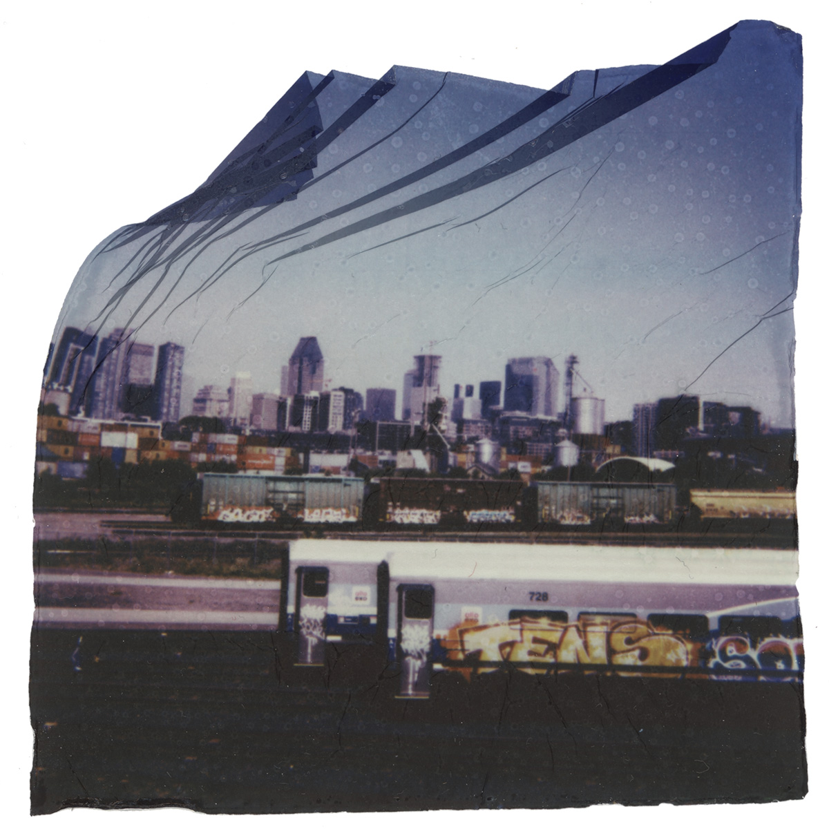 A view of the Montreal skyline with the Point-Saint-Charles train yard in the foreground.